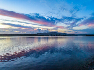 Sunrise, clouds, blue sky and water - a perfect day