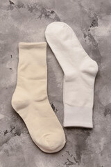 Different basic color socks on grey grunge background