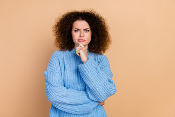 Photo portrait of pretty young girl thoughtful suspicious wear trendy blue knitwear outfit isolated...