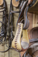 Stirrup hanging from a saddle.