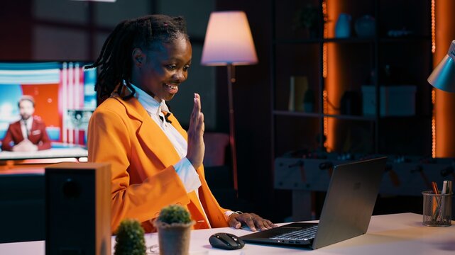 African american student communicating with professors and classmates on online class videocall, using academic web connection platforms. Girl participating in webinar college lesson. Camera A.