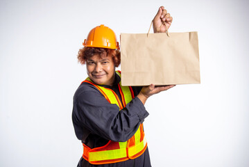 Workers, laborers wearing safety gear, holding brown paper bags, packed with lunch.