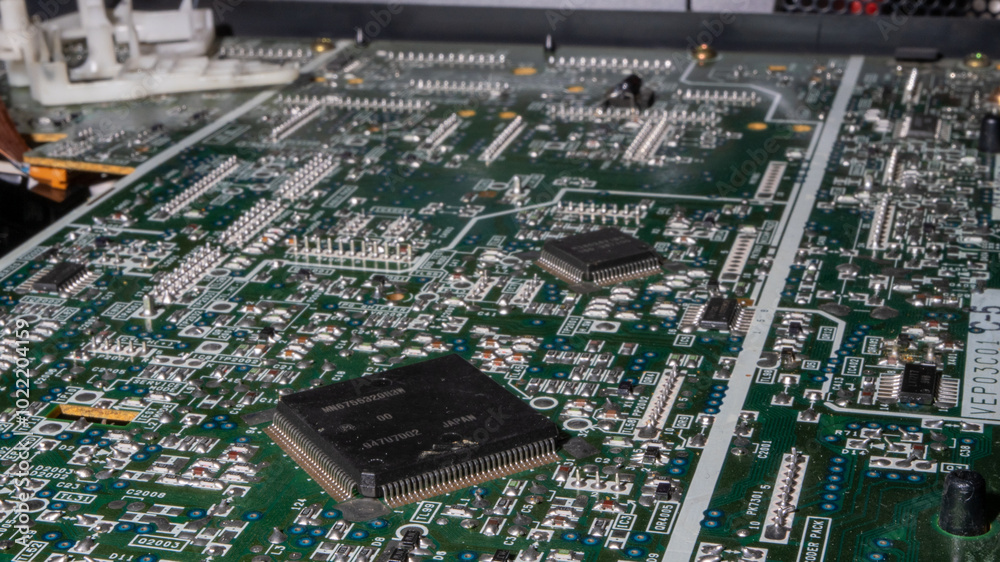 Poster a computer board with many small parts on it