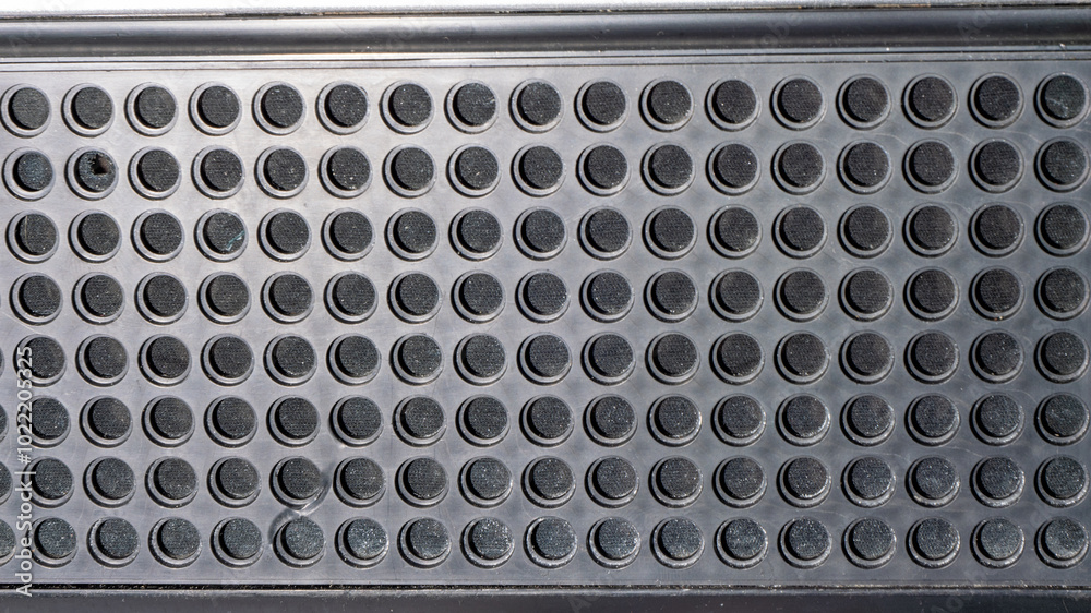 Aufkleber a close up of a black object with many small holes
