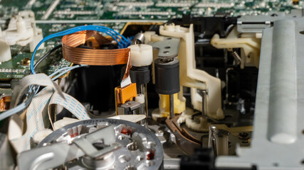 A close up of a broken old fashioned tape recorder