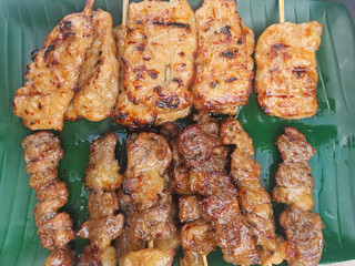 fried chicken and pork skewer with garlic and sauce