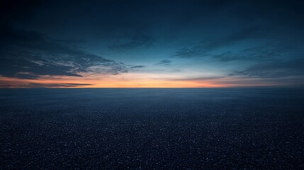 Fototapeta premium Asphalt Road Under a Dramatic Sunset Sky