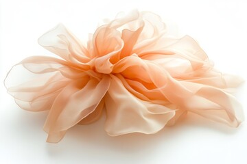 Fototapeta premium A vintage silk flower in muted beige tones dances gracefully in the autumn wind against a soft white backdrop