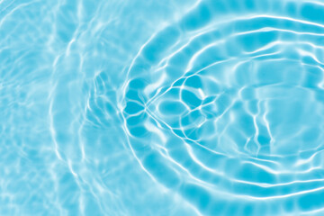 Blue water with ripples on the surface. Defocus blurred transparent blue colored clear calm water...