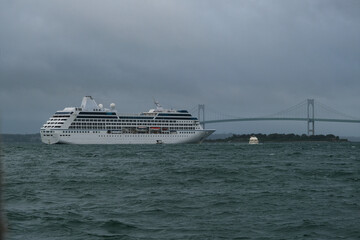 Small luxury cruiseship cruise ship liner Nautica anchoring at sea in bay of Newport, Rhode Island...