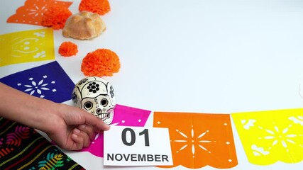  Day of the Dead backgrounds, white background, hand of a latina woman places a sign with the date November 01