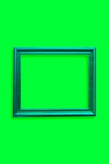 blue photo frame in a green wall vertical