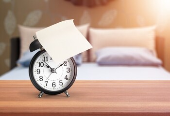 Alarm clock on table top in bedroom.