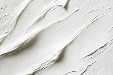 Obraz premium Thick white cream with smooth brushstrokes displayed in a clean, minimalistic setting for cosmetic product advertisement