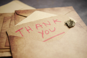 An Elegant Thank You Note accompanied by Vintage Envelopes and a beautiful Leaf Seal