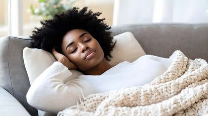 Person relaxing on couch with a book in hand, enjoying a quiet moment of solitude and introspection, embracing the simple pleasures of life.