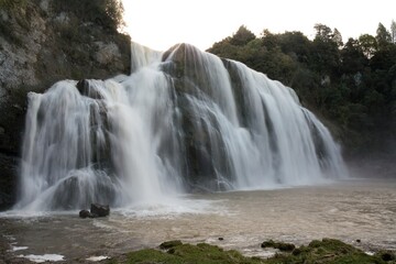 Fototapeta premium Waihi Falls in New Zealand - Majestic Waterfall in Lush Forest