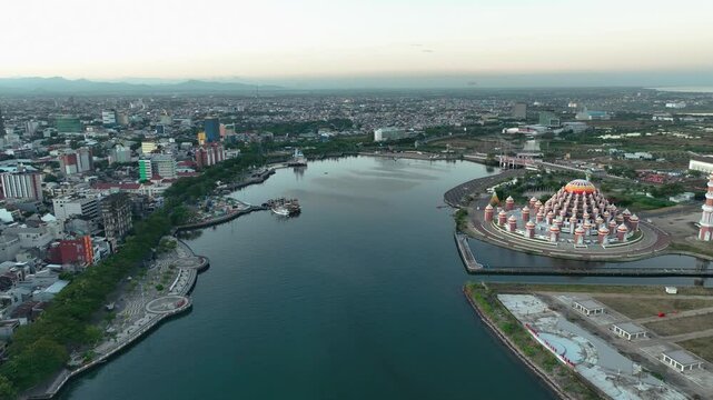 INDONESIA - 9.4.2024 - Fantastic aerial footage circling towards the 99 Domes Mosque in Makassar, Indonesia.