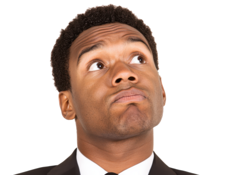 Confused businessman shrugging in professional attire for corporate use