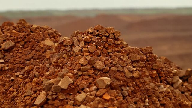 pile of mined bauxite is a sedimentary rock that contains high amounts of aluminum and is the main source of aluminum and gallium in the world, zoom in. 4K
