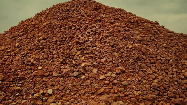 pile of mined bauxite is a sedimentary rock that contains high amounts of aluminum and is the main source of aluminum and gallium in the world, zoom in. 4K
