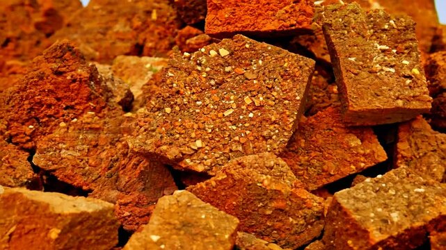 pile of mined bauxite is a sedimentary rock that contains high amounts of aluminum and is the main source of aluminum and gallium in the world, zoom in. 4K
