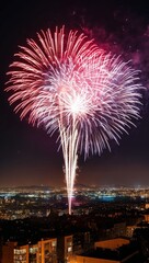 Sparkling fireworks over a cityscape at night background for invitation or card screensaver