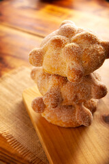 Pan de Muerto. Typical Mexican sweet bread that is consumed in the season of the day of the dead. It is a main element in the altars and offerings in the festivity of the day of the dead.