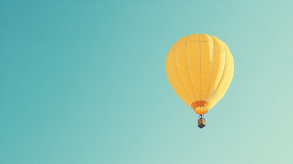 Naklejka premium A yellow hot air balloon floating gracefully in a clear blue sky, symbolizing adventure and exploration.