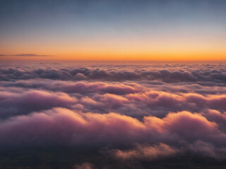 Obraz premium Low clouds lingering near the horizon at dawn, with the sky glowing in pastel shades of yellow, pink, and blue, creating a calming atmosphere 