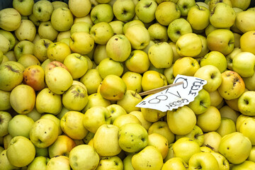 Pile of green apples for sale at a market