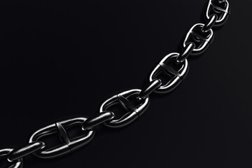 Obraz premium Links of a metal chain against a black background