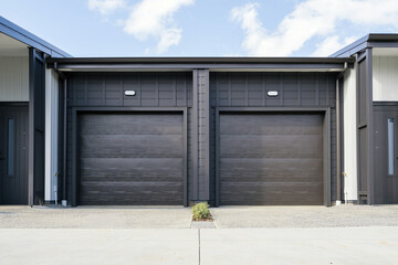 Duplex stacked garages with closed roller doors