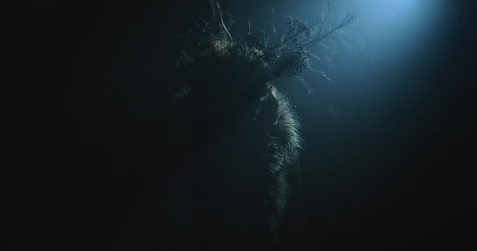 A witch conjures a witchcraft during the night storm