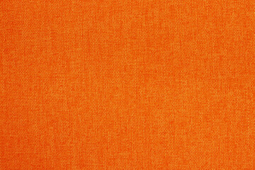 Fototapeta premium Orange fabric cloth texture background, seamless pattern of natural textile.