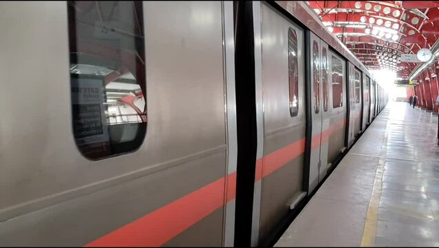 New Delhi, India, August 12 2024 - Delhi Metro train arriving at Jhandewalan metro station in New Delhi, India, Asia, Public Metro departing from Jhandewalan station