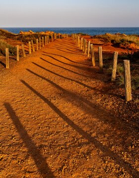 A red Pindan path leading to the Indian Ocean at Gantheaume Point, Broome Western Australia.