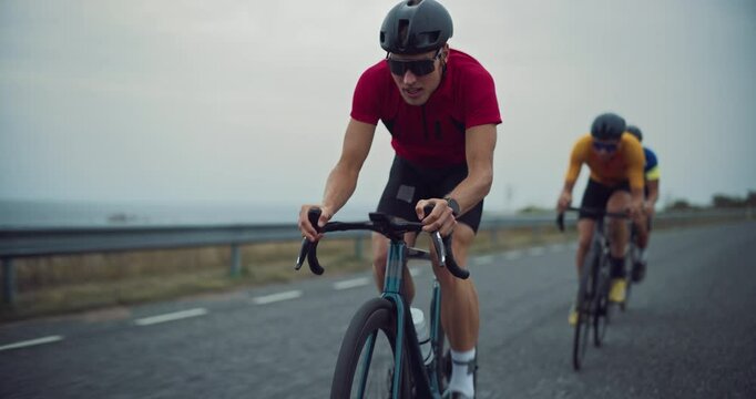 Diverse Cycling Team Races Intensely on an Open Road, Showcasing Endurance and Teamwork. Cyclists, Wearing Helmets and Colorful Jerseys, Pedal in Unison, Practicing for a Road Cycling Competition