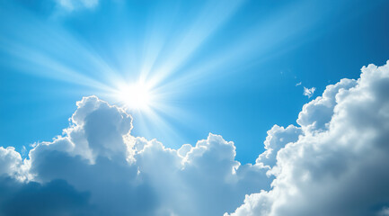 Radiant sunlight breaks through fluffy clouds over a clear blue sky in the early afternoon