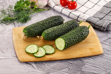 Raw green cucumbers with slices