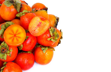 Many fresh persimmon fruits isolated on white background. Copy space for text.	