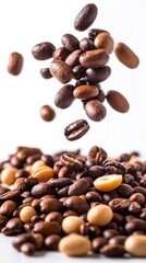 Obraz premium A collection of coffee beans, some floating above a mound of assorted roasted beans.