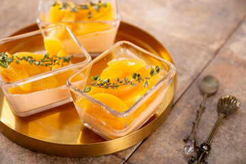 Traditional Italian dessert panna cotta with peaches