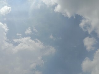 Fototapeta premium Grey clouds on blue sky in daytime. Cloud background. Presentation.