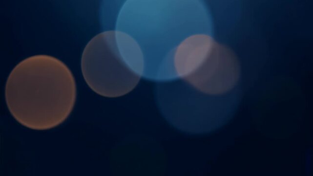 Abstract Bokeh Light Movement on Dark Blue Background