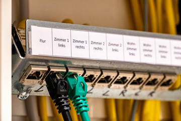 Ethernet network sockets or ports in a switch cabinet for distribution in an apartment, labeled in...