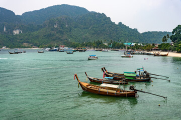 Tourist sea port shore with lots of boats in Asia