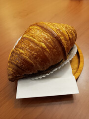 Plain and Original Croissant with tissue as a cover