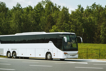 Roadside bus stop with white coach