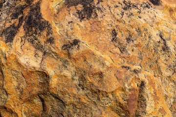 Extremely close up of an interesting shale rock texture pattern of featuring surface pattern highlights background.	